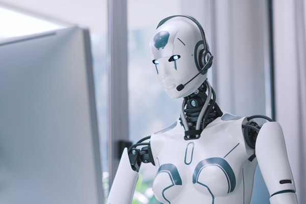 Robô usando computador, operando um chatbot.